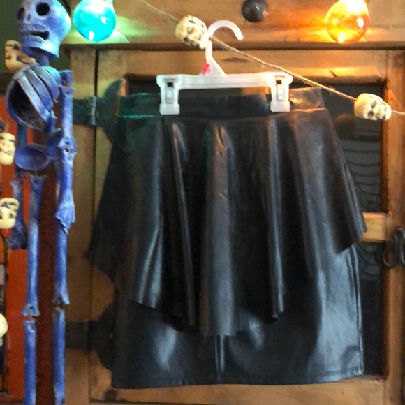 A totally cool vegan leather black peplum skirt. - Picture 3 of 6